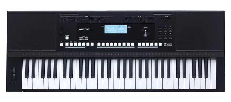 keyboard, 61 touch sensitive keys, backlit LCD, pitch-bend,  2 x 15 watt