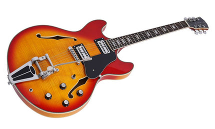 electric archtop guitar with tremolo, cherry sunburst