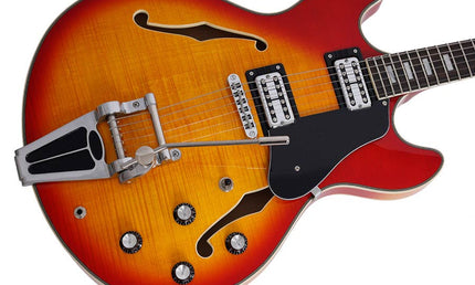 electric archtop guitar with tremolo, cherry sunburst